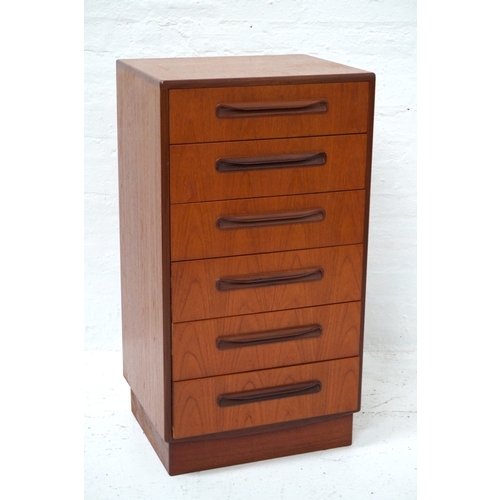 330 - G PLAN TEAK CHEST OF DRAWERS
of narrow proportions with six drawers with scroll handles, standing on... 