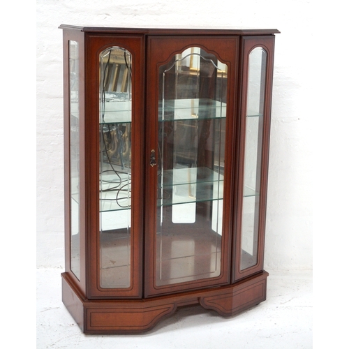 335 - TEAK BOW FRONT DISPLAY CABINET
with a moulded top above a central shaped glass door flanked by glass... 