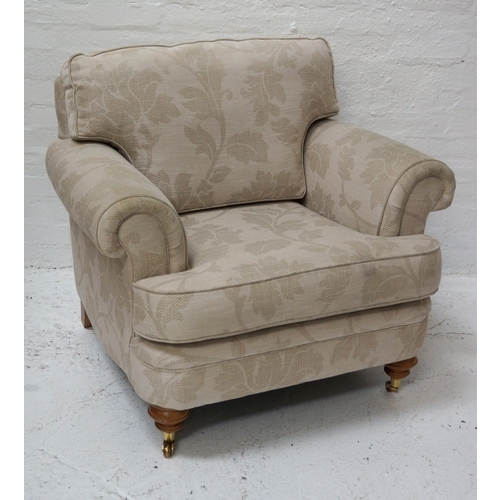 339 - LARGE ARMCHAIR
with a shaped back and seat cushion, scroll arms, standing on stout turned front supp... 