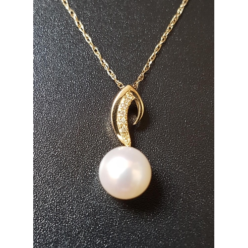 68 - PEARL AND DIAMOND PENDANT
in nine carat gold and on nine carat gold chain