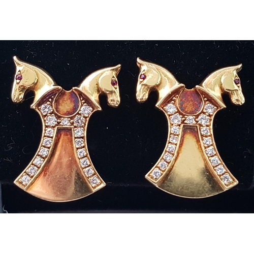 70 - PAIR OF EQUESTRIAN INTEREST DIAMOND AND RUBY EARRINGS
in eighteen carat gold, the double horse heads... 