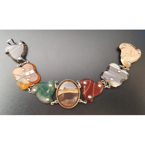 75 - AGATE SET BRACELET
formed with varying colours and shapes of agate, 19.5cm long