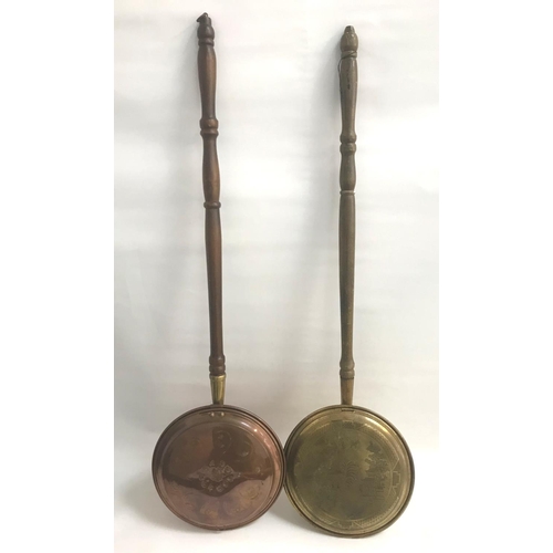 255 - COPPER WARMING PAN
with chased decoration to the circular lift up lid, with a turned wooden handle, ... 