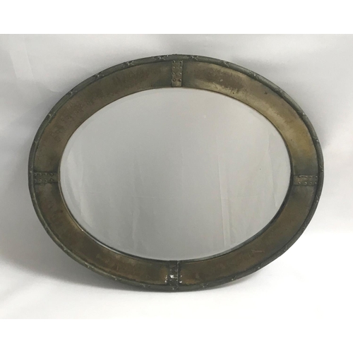 354 - EARLY 20TH CENTURY ARTS & CRAFTS DESIGN BRASS FRAMED OVAL WALL MIRROR 
with bound reeded edge and ha... 