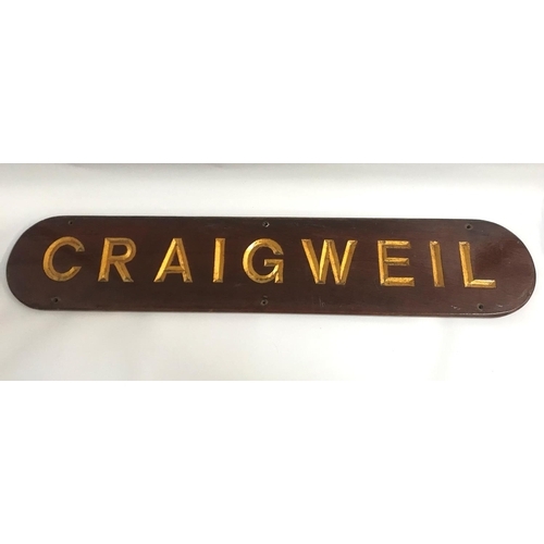 256 - SHAPED MAHOGANY NAME PLATE
for Craigweil, the reverse for Clarelle, possibly a house name plate, 91.... 