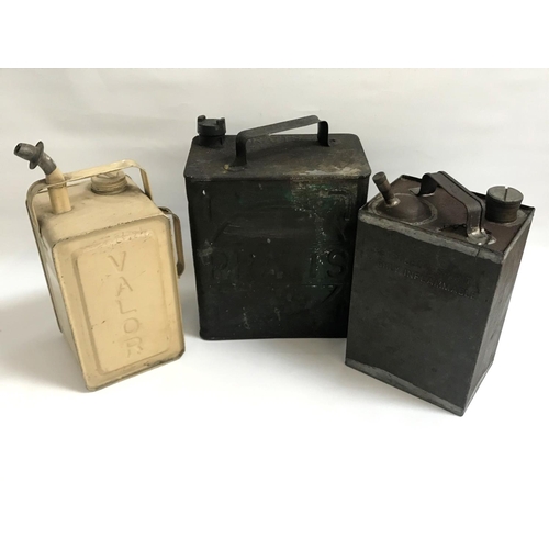 257 - THREE VINTAGE METAL FUEL CANS
one marked Pratts, Valour Esso Blue Paraffen and Petroleum Spirit High... 