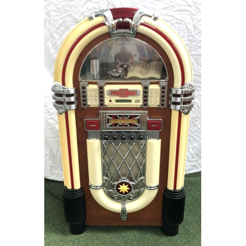 287 - 1940'S STYLE BABY JUKEBOX
in a shaped case with compact disc operation and an FM/AM radio, 100cm hig... 