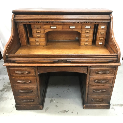 342 - OAK TAMBOUR FRONT ROLL TOP DESK
with a moulded top above a tambour front, opening to reveal a fitted... 