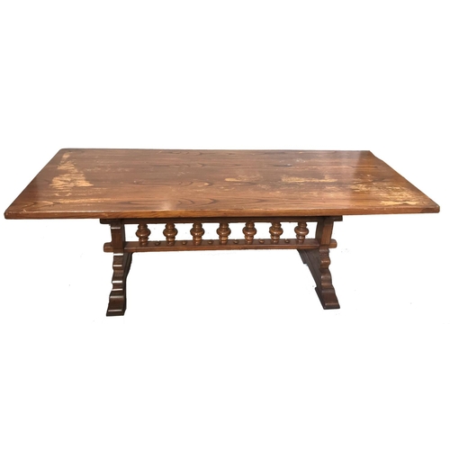 369 - CONTINENTAL OAK REFECTORY STYLE TABLE
with a one piece rectangular top standing on shaped end suppor... 