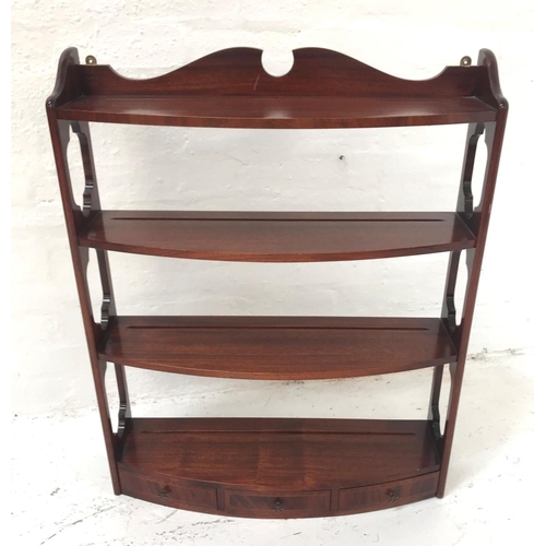 394 - WADE MAHOGANY BOW FRONT WALL SHELVES
with a shaped and carved top rail above pierced sides with four... 