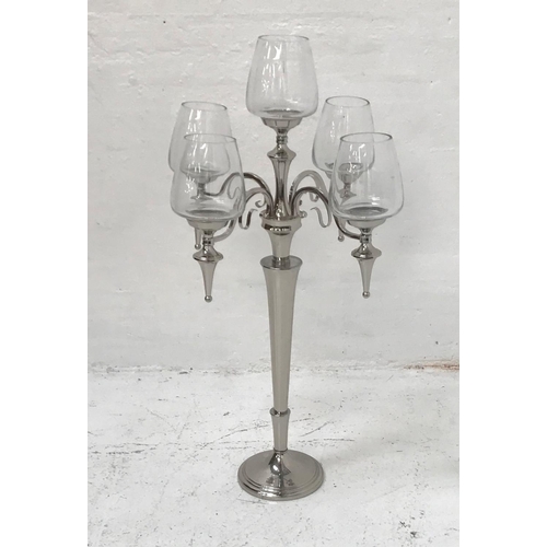 406 - ORNATE CHROME CANDELABRA
raised on a circular base and tapering column with four shaped decorative a... 