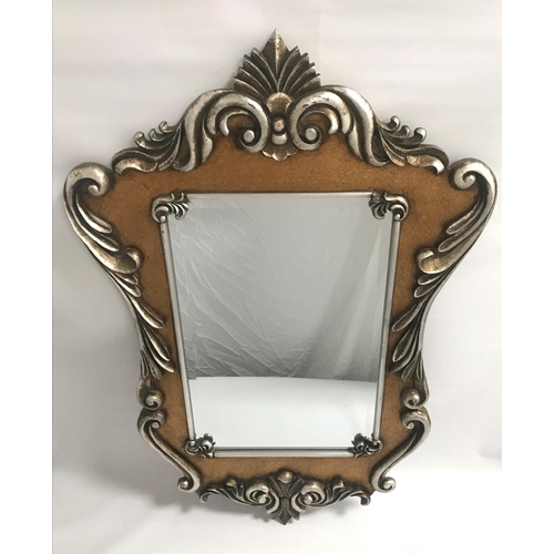 408 - ORNATE WALL MIRROR
in a silvered shaped wood frame with a central oblong beveled plate, 107cm high