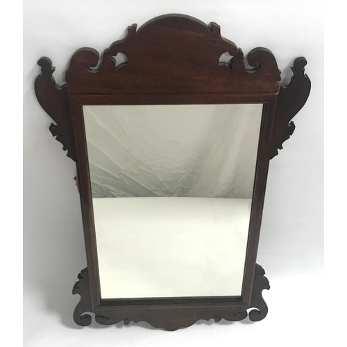 410 - GEORGIAN STYLE MAHOGANY FRET CARVED WALL MIRROR
with an oblong plate, 74cm high