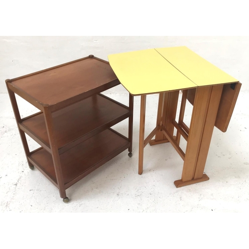 412 - 1960'S YELLOW MELAMINE GATELEG TABLE
with drop flaps, standing on plain supports united by a stretch... 