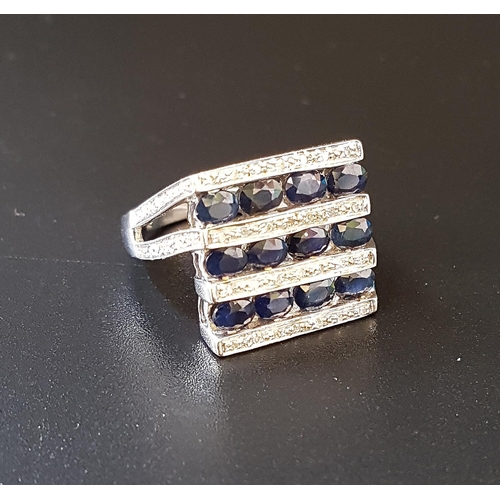 78 - UNUSUAL ART DECO STYLE SAPPHIRE AND DIAMOND DRESS RING
with alternating rows of oval cut sapphires a... 