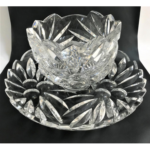 122 - EXTREMELY DECORATIVE CONTINENTAL CRYSTAL PUNCH BOWL AND TRAY
each with an irregular rim , the bodies... 