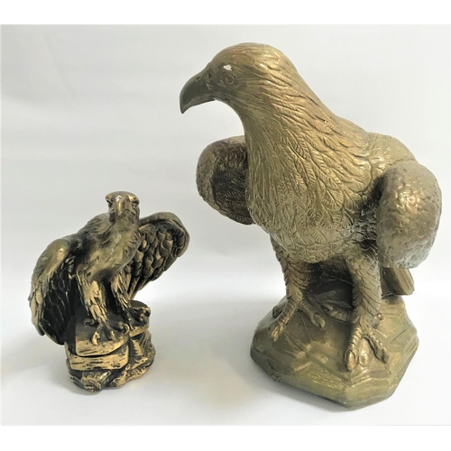 141 - POTTERY EAGLE FIGURINE
perched on a rocky base, 43cm high; together with a similar smaller eagle fig... 