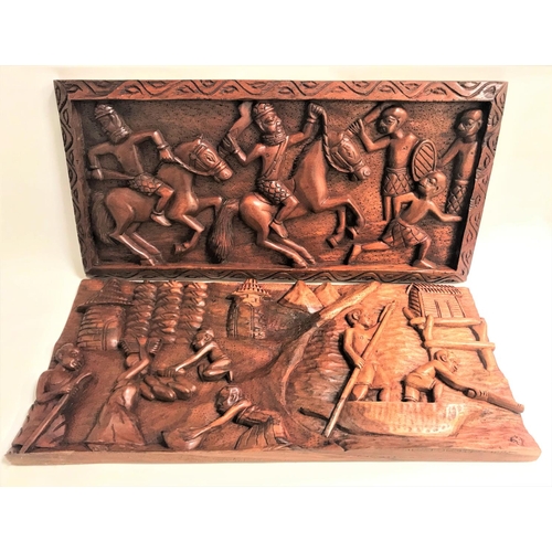 193 - TWO INDONESIAN RELIEF CRAVED RECTANGULAR TEAK PANELS
one with village scene and villagers carrying o... 