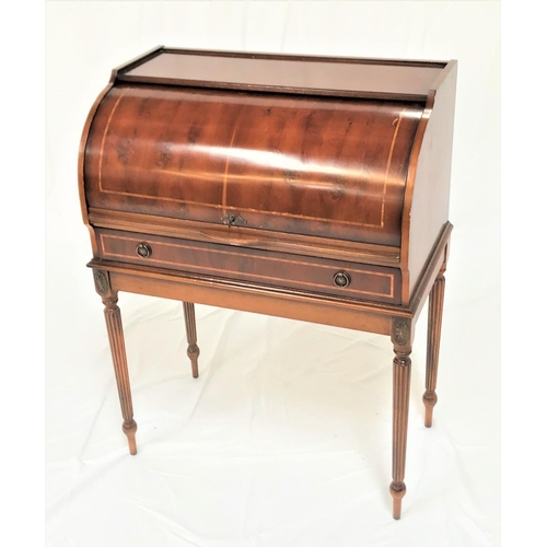 463 - YEW CYLINDER DESK
with a fitted interior and pull out leather inset shelf above a frieze drawer, sta... 