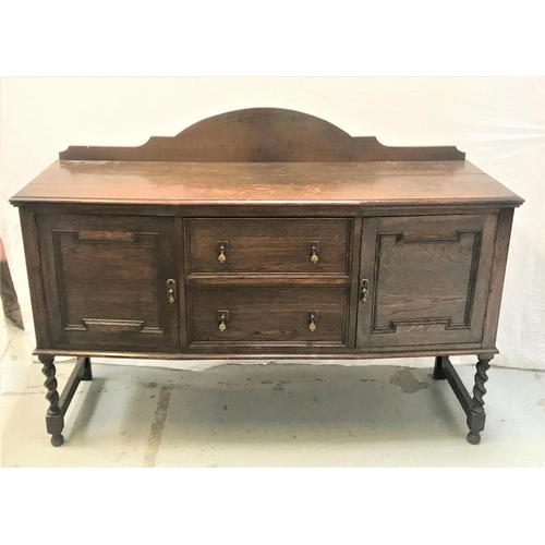 464 - OAK BOW FRONT SIDEBOARD
with a shaped and raised back above a moulded top with two central panelled ... 