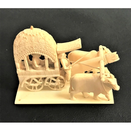 177 - EARLY 20TH CENTURY INDIAN IVORY GROUP
depicting two oxen pulling a cart, 9.5cm long