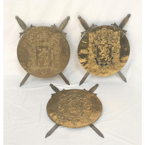 179 - THREE BRASS HERALDIC STYLE SHIELDS
centered with an embossed lion rampant surrounded by embossed oak... 