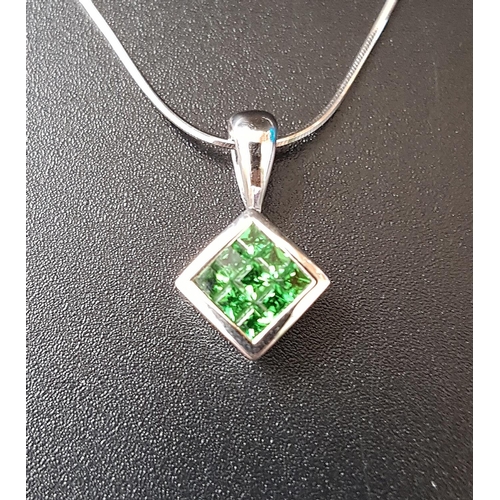 80 - TSAVORITE GARNET PENDANT
the nine gemstones totaling approximately 0.53cts in rhomboid shaped eighte... 