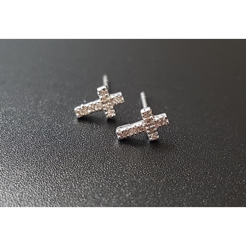 88 - PAIR OF DIAMOND SET CROSS SHAPED STUD EARRINGS
in nine carat white gold, each earring approximately ... 