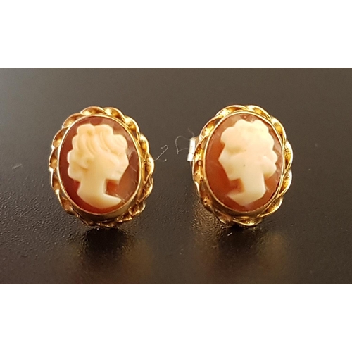 89 - PAIR OF SHELL CAMEO EARRINGS
each with female bust in profile, in unmarked gold mounts, the butterfl... 