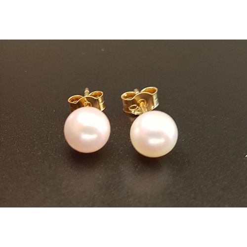 99 - PAIR OF CULTURED PEARL STUD EARRINGS
in eighteen carat gold mounts