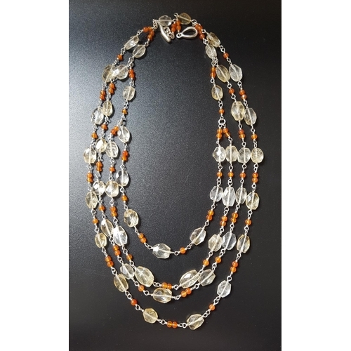 74 - ROCK CRYSTAL AND ORANGE AGATE NECKLACE
the four strand necklace with faceted crystasl beads separate... 