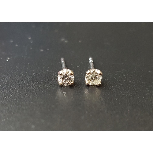 100 - PAIR OF DIAMOND STUD EARRINGS
the round brilliant cut diamonds totaling approximately 0.18cts, in ni... 