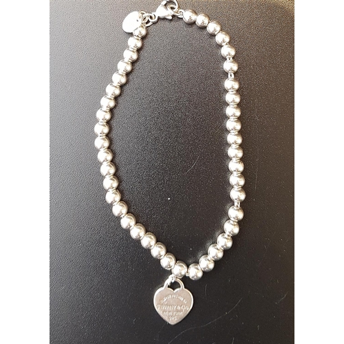 69 - TIFFANY AND CO SILVER BEAD BRACELET
with return to Tiffany heart tag