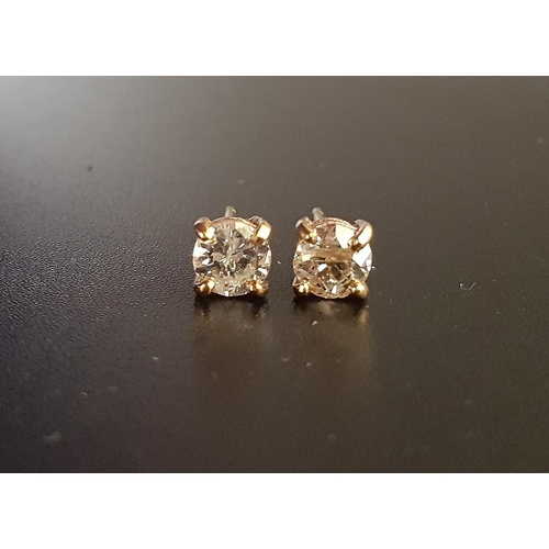 83 - DIAMOND SOLITAIRE EARRINGS
the round cut diamonds totalling approximately 1ct, in unmarked gold