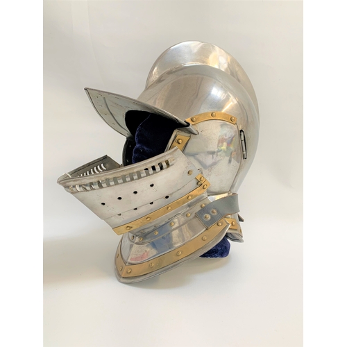 64 - 16TH CENTURY STYLE STEEL CLOSE HELMET
with a raised comb and one piece skull, with detachable hinged... 