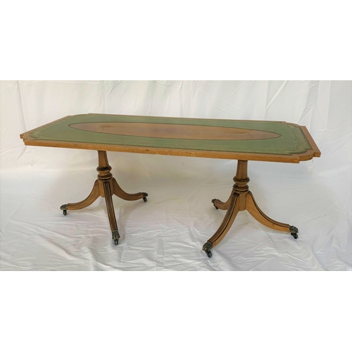 80 - OBLONG MAHOGANY OCCASIONAL TABLE
with an inset green leather top, standing on twin turned columns, e... 