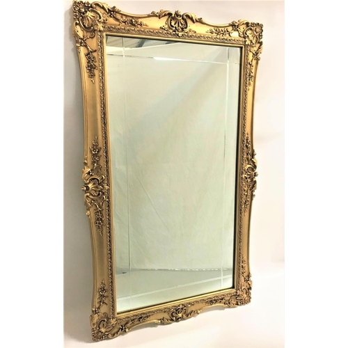 81 - GILT FRAME OBLONG WALL MIRROR
the frame decorated with shells and garlands around the plate, with ch... 