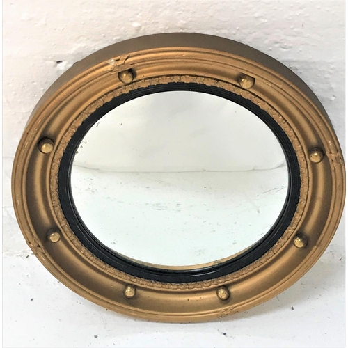 84 - CIRCULAR GILT FRAME WALL MIRROR
with applied ball decoration around the convex plate, 42.5cm diamete... 