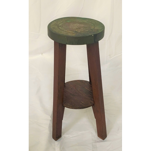 85 - NORTH AFRICAN STYLE STOOL
with a circular copper seat with chased decoration, standing on four stain... 