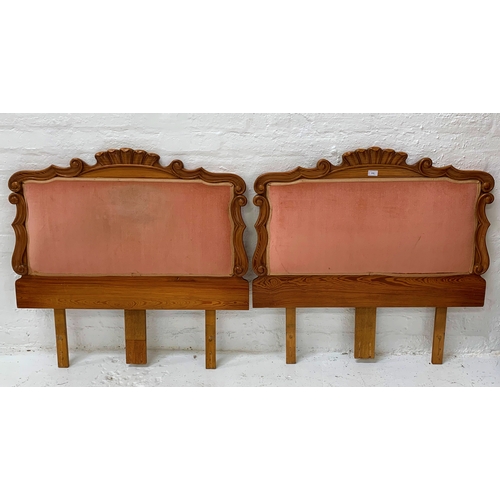 86 - PAIR OF PINE SINGLE BED HEADBOARDS
with shaped carved tops and sides and a pink draylon padded secti... 