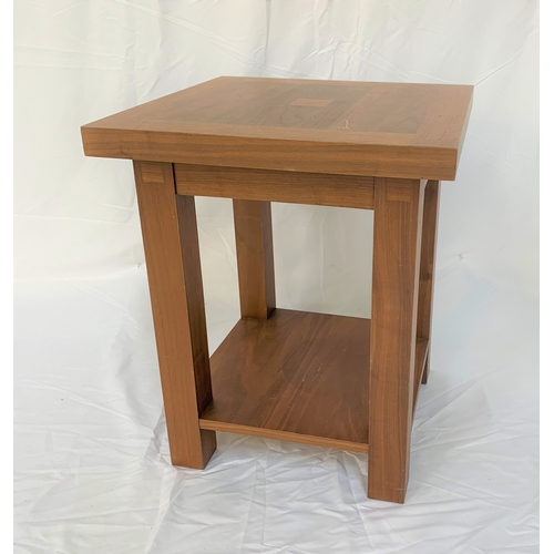 92 - TUCAN FURNITURE TEAK OCCASIONAL TABLE
with a square top, standing on plain supports united by an und... 