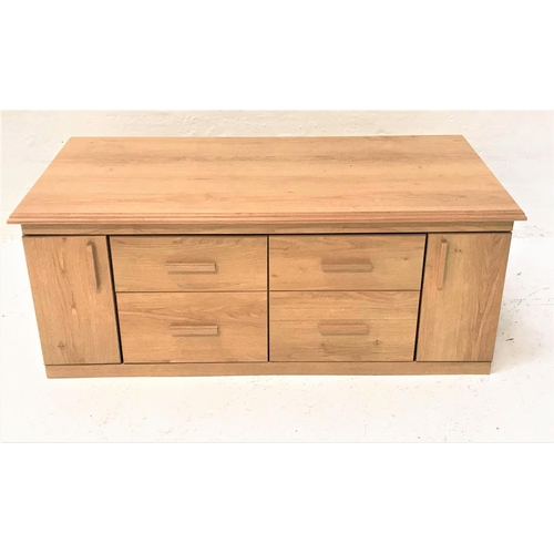 98 - LIGHT OAK LOW SIDE CABINET
with a moulded oblong top above four central drawers flanked by a pair of... 