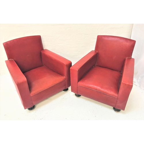 106 - PAIR OF CLUB ARMCHAIRS
covered in red vinyl, standing on flattened bun feet with castors (2)