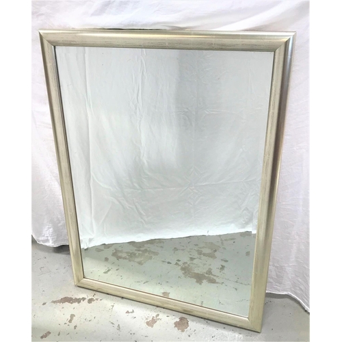 110 - LARGE OBLONG WALL MIRROR
with a silver wood frame around a bevelled plate, 112.5cm x 85cm