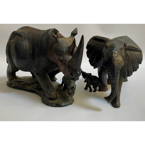 193 - TWO AFRICAN CARVED EBONY ANIMAL ORNAMENTS
one depicting Elephant with calf, and the other a Rhinocer... 