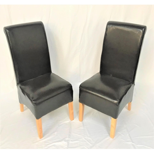 457 - SET OF SIX HIGH BACK DINING CHAIRS
with padded brown leather backs and seats, standing on tapering f... 