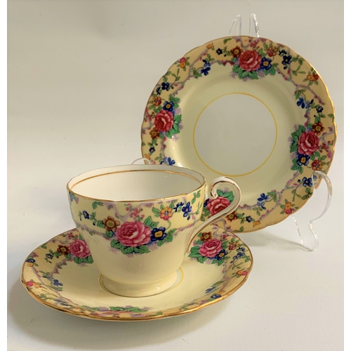 146 - AYNSLEY  TEA SERVICE
the white and pale yellow ground decorated with roses and other flowers with gi... 