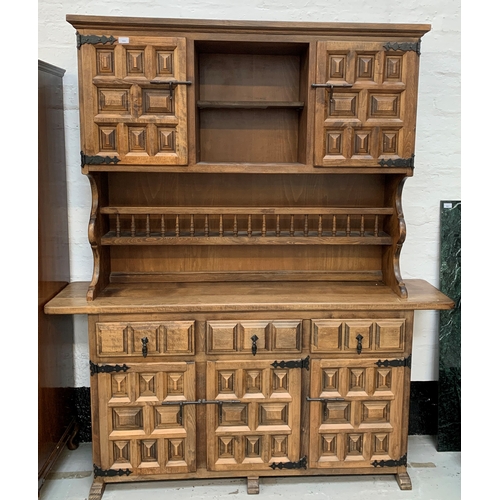 433 - CONTINENTAL STYLE TEAK DRESSER
with a plain moulded top above a central open shelf flanked by a pair... 