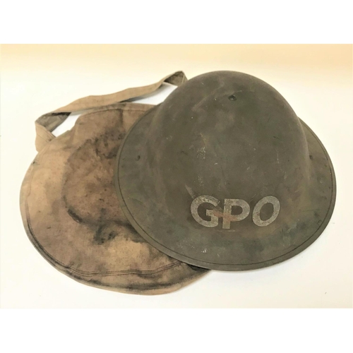 284 - WWII BRITISH STEEL HELMET
marked GPO, with adjustable chin strap and over shoulder carry pouch