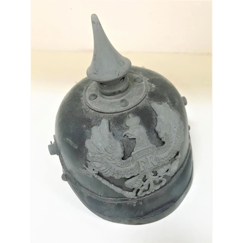 296 - WWI IMPERIAL GERMAN PICKELHAUBE
of leather construction with steel furniture, the interior marked 54